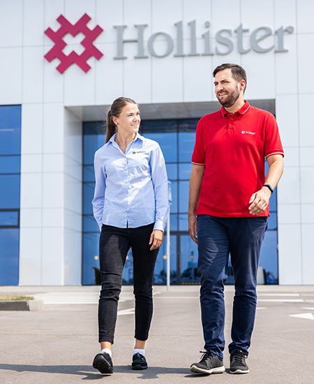 Hollister Lithuania man and woman walking out of Hollister building